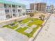 Beachfront lawn including fire pit and picnic tables for outdoor gathering at 3641 S Atlantic Ave # 110, Daytona Beach, FL 32118