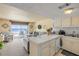 Open floor plan with kitchen and living room with a view of the beach and pier at 3641 S Atlantic Ave # 110, Daytona Beach, FL 32118