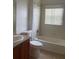 Clean bathroom with a vanity, toilet, and tiled shower and bathtub combination at 3651 Sail Harbor Dr, Kissimmee, FL 34746