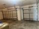 Two-car garage with two garage doors and concrete flooring at 3651 Sail Harbor Dr, Kissimmee, FL 34746
