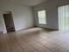 The living room features tile flooring and natural light from the windows at 3651 Sail Harbor Dr, Kissimmee, FL 34746