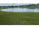 Scenic view of a tranquil pond, creating a serene backdrop for this picturesque property at 3651 Sail Harbor Dr, Kissimmee, FL 34746