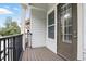 Light and airy balcony with dark wood floors and a black metal railing at 439 Windmill Palm Cir, Altamonte Springs, FL 32701