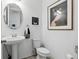 Cozy bathroom featuring white walls, a pedestal sink, and modern finishes at 439 Windmill Palm Cir, Altamonte Springs, FL 32701