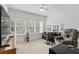 Bright room with large windows, cozy seating, and a functional workspace at 439 Windmill Palm Cir, Altamonte Springs, FL 32701