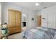 Light-filled bedroom featuring neutral walls and doorway to bathroom at 439 Windmill Palm Cir, Altamonte Springs, FL 32701