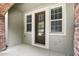 This inviting entrance features sidelight windows and a brick archway, enhancing its charm at 439 Windmill Palm Cir, Altamonte Springs, FL 32701