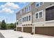 Townhome exterior with three units, garages, and well-maintained landscaping at 439 Windmill Palm Cir, Altamonte Springs, FL 32701