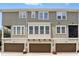 Townhome exterior showing three units, garages, and well maintained landscaping at 439 Windmill Palm Cir, Altamonte Springs, FL 32701