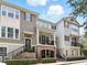 Charming townhome with inviting porch and well-maintained landscaping for great curb appeal at 439 Windmill Palm Cir, Altamonte Springs, FL 32701