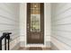 Inviting front door with glass pane, and brick pavers creates a warm and welcoming entrance at 439 Windmill Palm Cir, Altamonte Springs, FL 32701