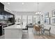 A bright, open kitchen with quartz countertops, a center island, and modern appliances at 439 Windmill Palm Cir, Altamonte Springs, FL 32701