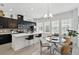 Open kitchen and dining area with bright light, a center island, stainless appliances, and modern finishes at 439 Windmill Palm Cir, Altamonte Springs, FL 32701