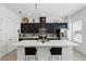 Well-lit kitchen with quartz countertops, black cabinets, stainless steel appliances, and center island at 439 Windmill Palm Cir, Altamonte Springs, FL 32701