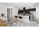 A bright, open kitchen and dining area with stainless steel appliances and modern finishes at 439 Windmill Palm Cir, Altamonte Springs, FL 32701