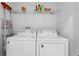 Functional laundry area with washer, dryer and plenty of storage space at 439 Windmill Palm Cir, Altamonte Springs, FL 32701