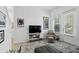 Inviting living room featuring bright natural light, stylish decor, and a comfortable space at 439 Windmill Palm Cir, Altamonte Springs, FL 32701