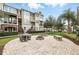 A outdoor patio with a fire pit provides an inviting outdoor area for gatherings and relaxation at 439 Windmill Palm Cir, Altamonte Springs, FL 32701