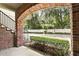 This porch offers a view of well-maintained landscaping and a neighborhood street at 439 Windmill Palm Cir, Altamonte Springs, FL 32701