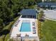Aerial view of a community pool with lounge chairs, and clubhouse at 4414 Le Reve Ct, Kissimmee, FL 34746