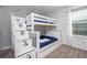 bedroom with Disney themed decor, carpeted floors and natural lighting at 4414 Le Reve Ct, Kissimmee, FL 34746