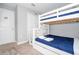 bedroom with Disney themed bunkbeds, carpeted floors and natural lighting at 4414 Le Reve Ct, Kissimmee, FL 34746