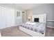 This bedroom has a closet, and white trim, plus comfortable gray decor at 4414 Le Reve Ct, Kissimmee, FL 34746