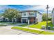 Exterior view of modern two-story townhomes with well manicured landscaping at 4414 Le Reve Ct, Kissimmee, FL 34746