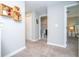 Hallway with carpeted floors leading to a bathroom and bedroom at 4414 Le Reve Ct, Kissimmee, FL 34746