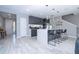Bright, modern kitchen features an island with seating and sleek, grey cabinets at 4414 Le Reve Ct, Kissimmee, FL 34746