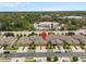 Aerial view of townhomes, showing location with nearby businesses, landscaping, garages and street parking at 479 Harbor Winds Ct, Winter Springs, FL 32708