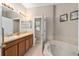 Relax in this bathroom featuring a soaking tub, dual sinks, and a vanity with ample counter space at 479 Harbor Winds Ct, Winter Springs, FL 32708
