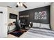 Bedroom featuring a black accent wall, ceiling fan, and a dedicated gaming area at 479 Harbor Winds Ct, Winter Springs, FL 32708