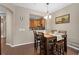 Cozy dining room with hardwood floors and a pass-through to the bright kitchen at 479 Harbor Winds Ct, Winter Springs, FL 32708