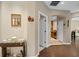 Hallway with hardwood flooring leads to kitchen and living areas at 479 Harbor Winds Ct, Winter Springs, FL 32708