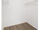 Walk-in closet features wire shelving and wood-look flooring at 4870 S Semoran Blvd # 1905, Orlando, FL 32822