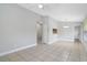 Open living space with tile flooring, leading to dining area, and offering ample natural light at 4870 S Semoran Blvd # 1905, Orlando, FL 32822