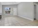 Bright living room showcasing neutral paint, tile floors, and a charming fireplace at 4870 S Semoran Blvd # 1905, Orlando, FL 32822