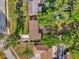 Overhead view of home with a large lot showcasing mature trees and a well-maintained lawn at 512 Dixson St, Orange City, FL 32763