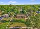 Aerial view of a house with lot lines displayed, showing its boundaries and location at 512 Dixson St, Orange City, FL 32763