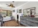 Bedroom with gray dresser, ceiling fan, and access to the sunroom at 512 Dixson St, Orange City, FL 32763