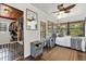 Bedroom with a ceiling fan, sunroom access, and access to the closet at 512 Dixson St, Orange City, FL 32763