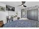 Well-lit bedroom with a stylish bed, workspace, and decorative wallpaper at 512 Dixson St, Orange City, FL 32763