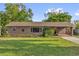Charming single-story home with a well-maintained lawn and inviting curb appeal at 512 Dixson St, Orange City, FL 32763