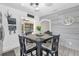 Bright eat-in kitchen featuring white cabinets and a view into the outdoor area at 512 Dixson St, Orange City, FL 32763