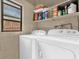 Laundry room features shelving and a window for extra lighting at 512 Dixson St, Orange City, FL 32763