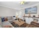 Cozy living room featuring a comfortable sectional sofa and stylish decor elements at 512 Dixson St, Orange City, FL 32763