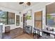 Bright sunroom with tile flooring, neutral colors, and backyard access at 512 Dixson St, Orange City, FL 32763