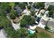 Charming neighborhood aerial view with mature trees and well-maintained homes at 5165 Mystic Point Ct, Orlando, FL 32812