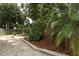 The home has a backyard with mature landscaping and stone fire pit at 5165 Mystic Point Ct, Orlando, FL 32812